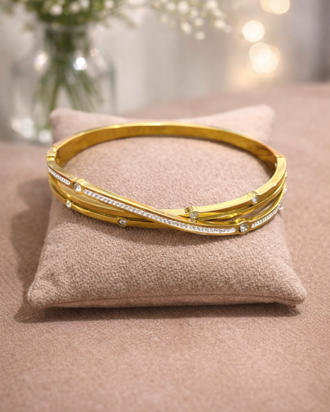 Elegant Gold Twist Bracelet with Zircon Detailing