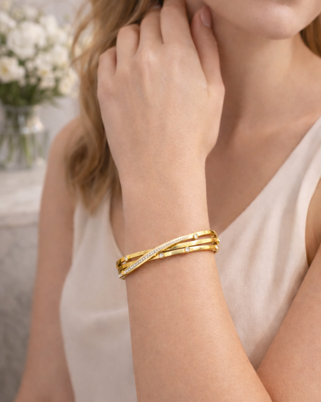 Elegant Gold Twist Bracelet with Zircon Detailing